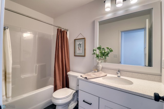 full bathroom featuring vanity, toilet, and shower / tub combo