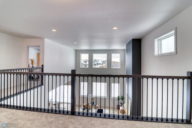 corridor with carpet floors, recessed lighting, and plenty of natural light
