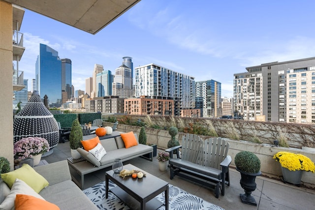 view of patio featuring a view of skyline and outdoor lounge area