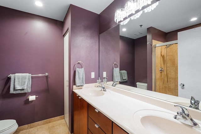 full bathroom with toilet, a tile shower, double vanity, tile patterned floors, and recessed lighting