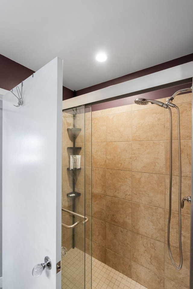 bathroom featuring a stall shower and recessed lighting