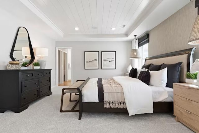 bedroom featuring a tray ceiling, light colored carpet, and wood ceiling