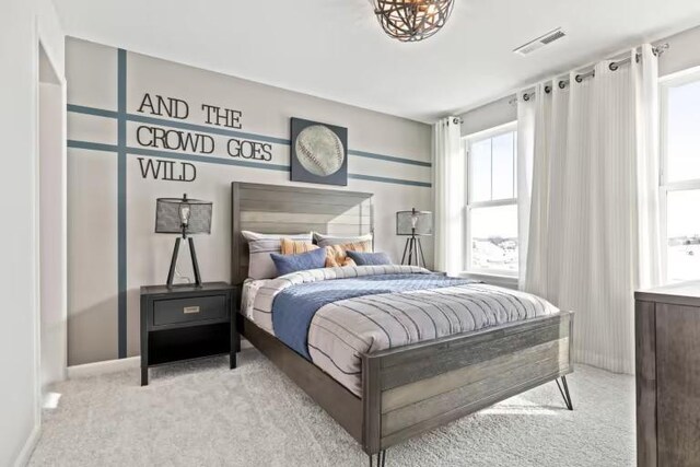 bedroom featuring carpet floors and baseboards