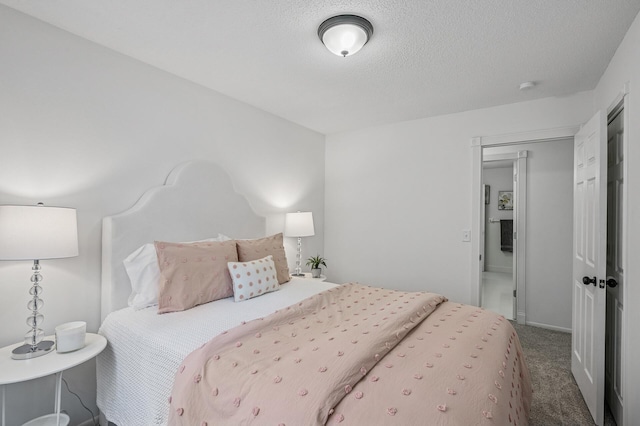 135 Eagle Lake Dr, Maple Grove, MN 55369 - carpeted bedroom with a textured ceiling and baseboards