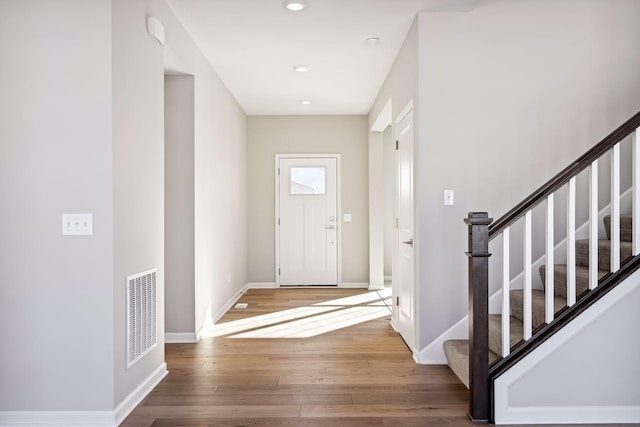 7197 Large Ave NE, Otsego, MN 55301 - entryway with wood finished floors, stairs, baseboards, and recessed lighting