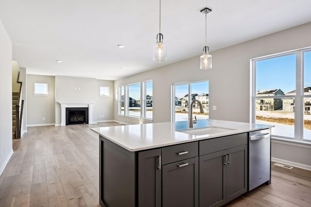 7197 Large Ave NE, Otsego, MN 55301 - kitchen featuring a sink, dishwasher, gray cabinets, light countertops, and recessed lighting