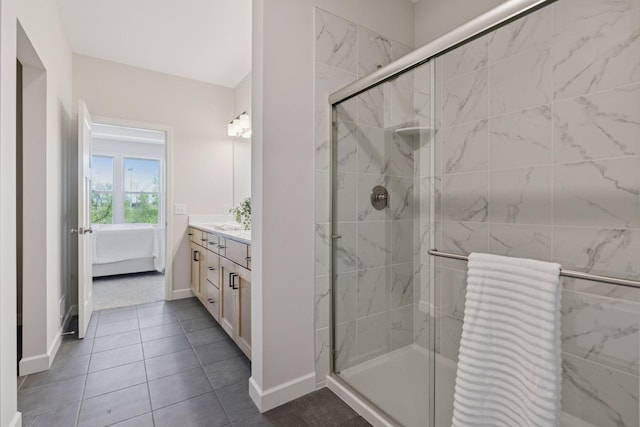 18531 Ifton Way, Lakeville, MN 55044 - full bath featuring a stall shower, vanity, baseboards, tile patterned flooring, and ensuite bathroom