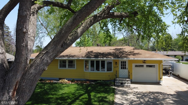 2828 Matilda St, Roseville, MN 55113 - view of front facade featuring concrete driveway, an attached garage, and roof with shingles