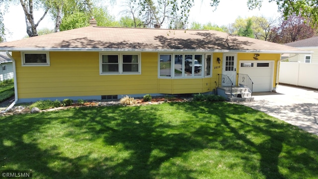 2828 Matilda St, Roseville, MN 55113 - view of front facade featuring a garage, concrete driveway, a chimney, and roof with shingles