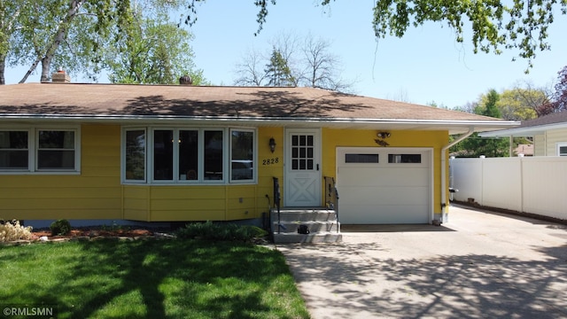 2828 Matilda St, Roseville, MN 55113 - view of front of property with driveway and a garage