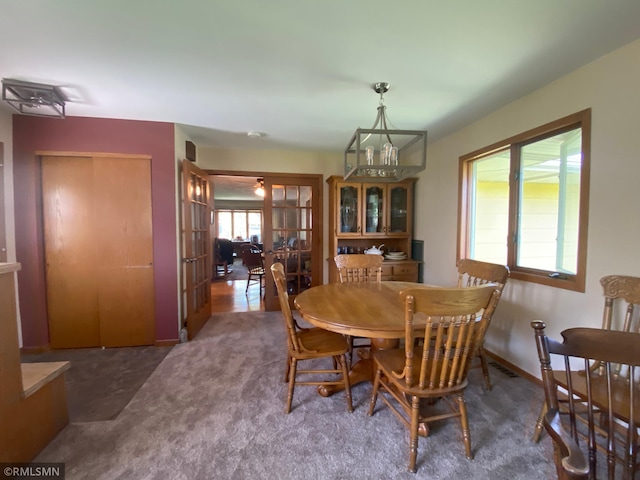2828 Matilda St, Roseville, MN 55113 - carpeted dining area with french doors and baseboards