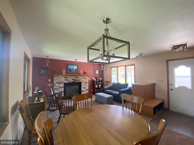 2828 Matilda St, Roseville, MN 55113 - dining space featuring a fireplace and a chandelier