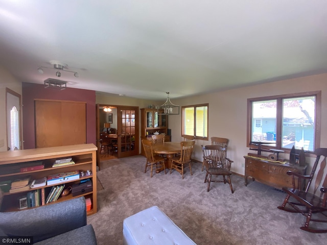 2828 Matilda St, Roseville, MN 55113 - carpeted living area featuring a chandelier