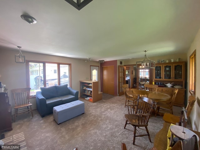 2828 Matilda St, Roseville, MN 55113 - living room featuring a chandelier and carpet floors