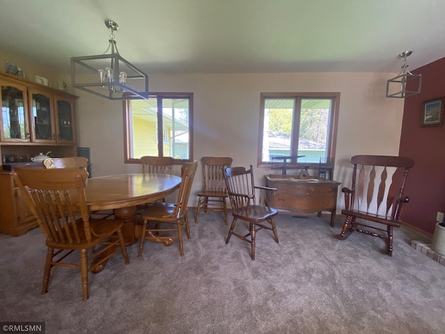 2828 Matilda St, Roseville, MN 55113 - dining area with a chandelier and carpet floors