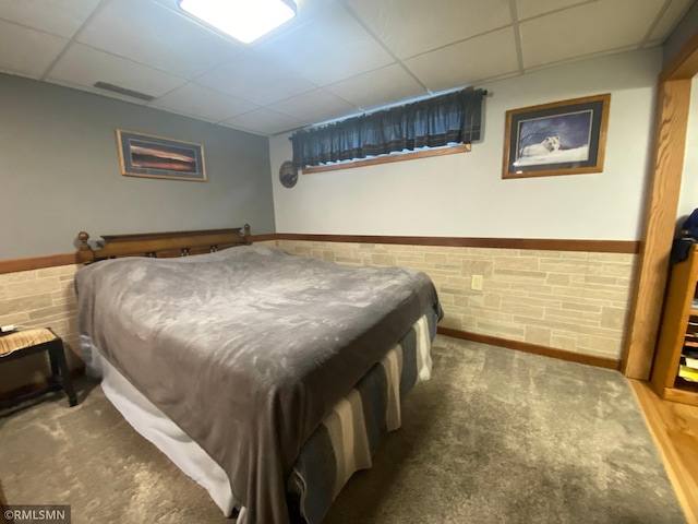 2828 Matilda St, Roseville, MN 55113 - carpeted bedroom featuring a drop ceiling and a wainscoted wall