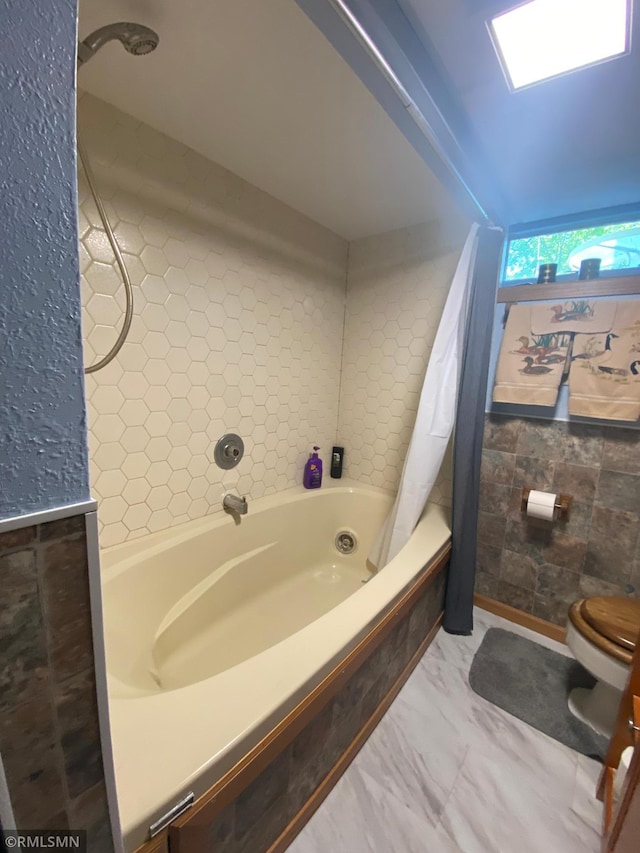 2828 Matilda St, Roseville, MN 55113 - full bathroom with a tub, toilet, a shower with curtain, and tile walls