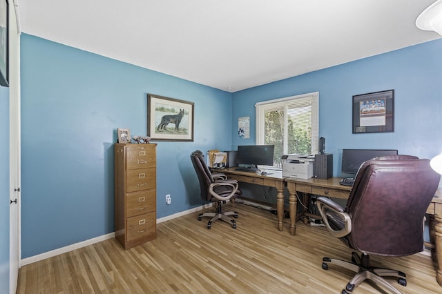office area featuring wood finished floors and baseboards