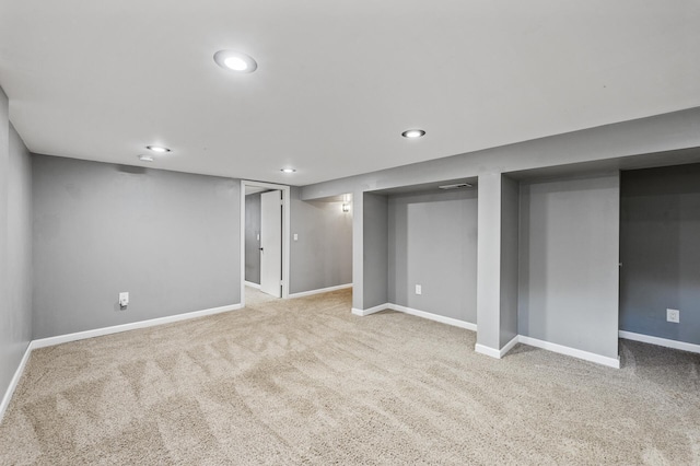 finished below grade area featuring carpet, baseboards, and recessed lighting