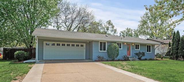 ranch-style house featuring a garage and concrete driveway