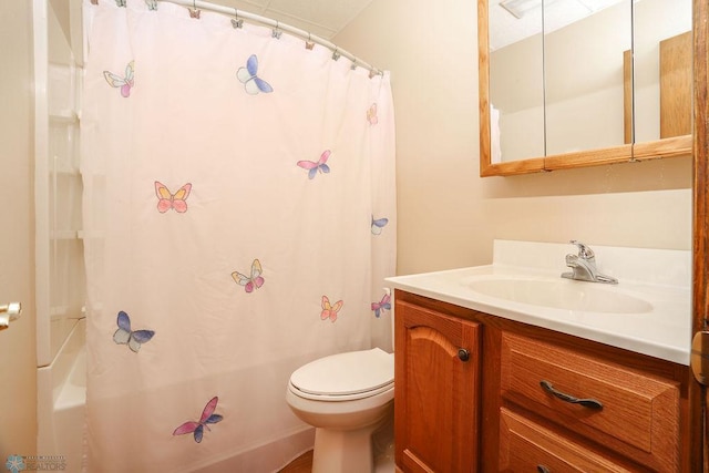 full bath with toilet, vanity, and shower / bath combo