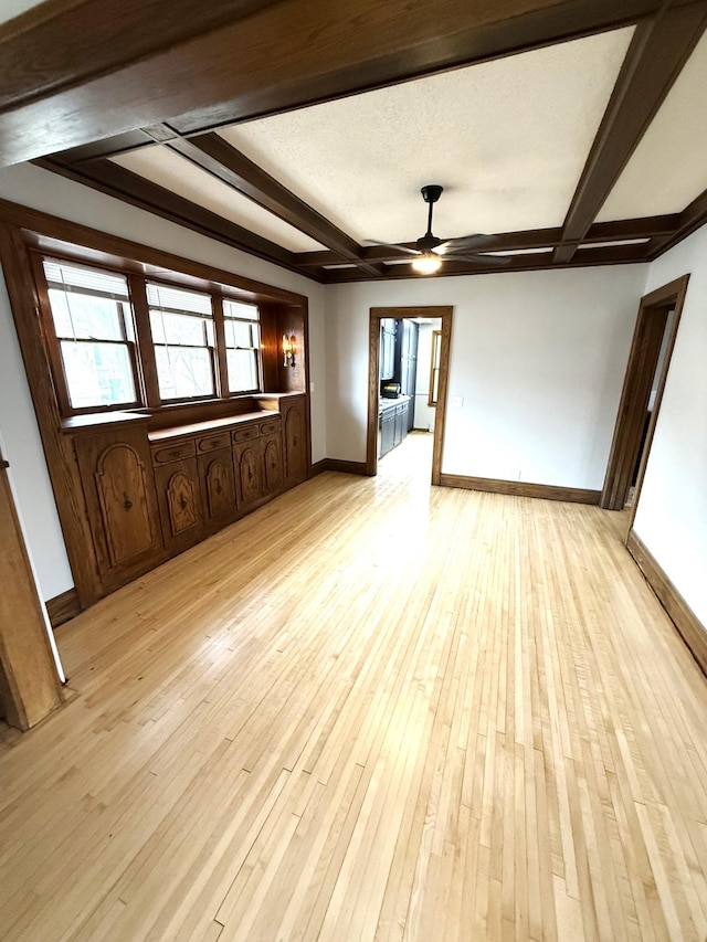 455 3rd St SE, Cokato, MN 55321 - unfurnished room featuring ceiling fan, beamed ceiling, and light wood-style flooring
