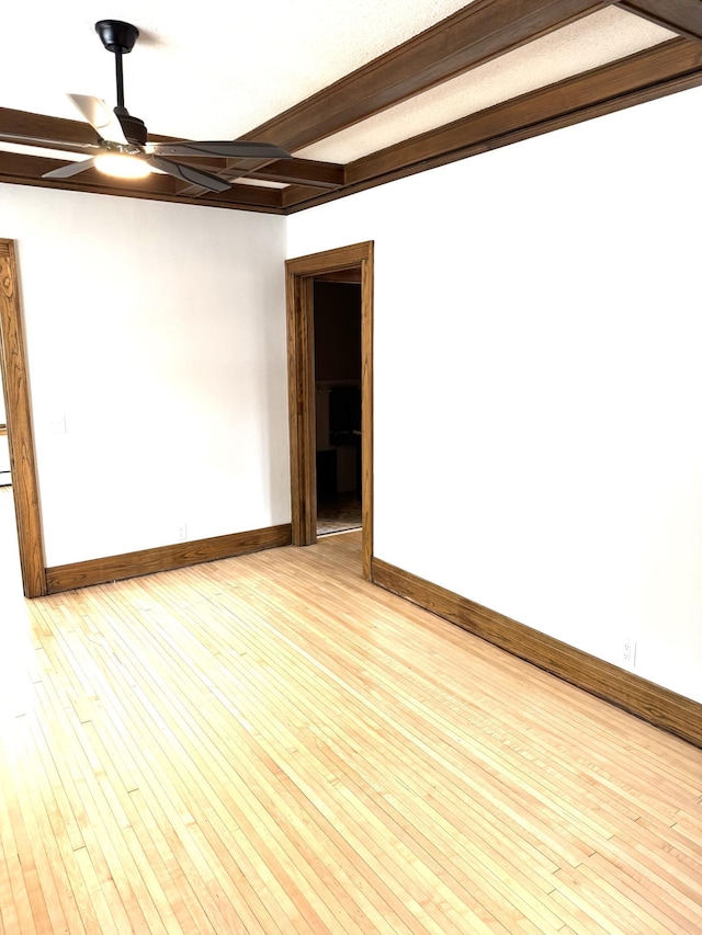 455 3rd St SE, Cokato, MN 55321 - empty room featuring ceiling fan, hardwood / wood-style flooring, and beam ceiling