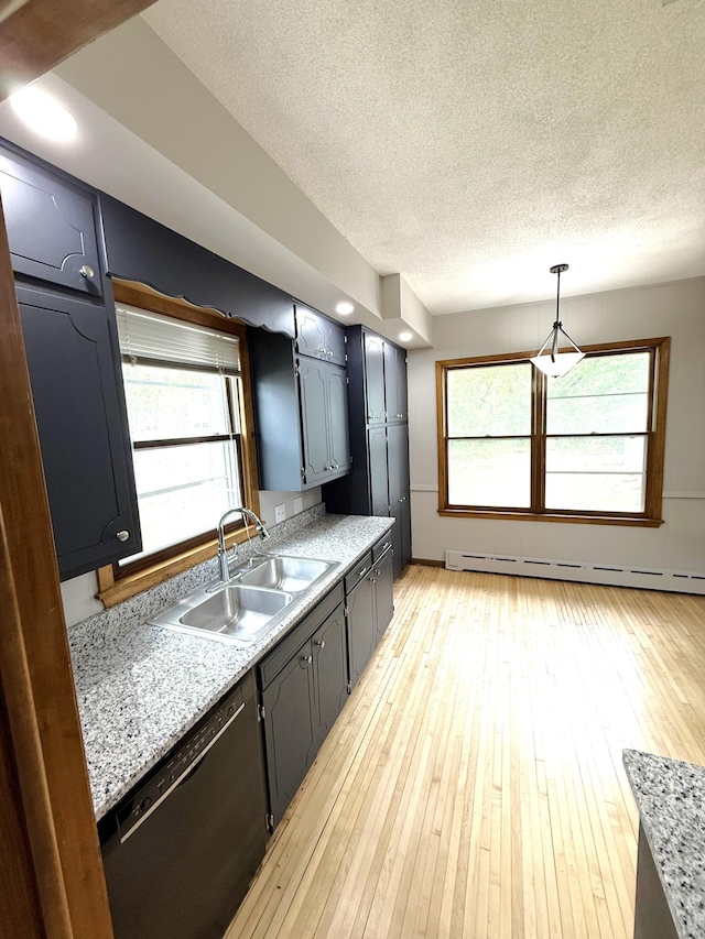 455 3rd St SE, Cokato, MN 55321 - kitchen with a baseboard heating unit, a textured ceiling, light countertops, black dishwasher, and light wood-style flooring