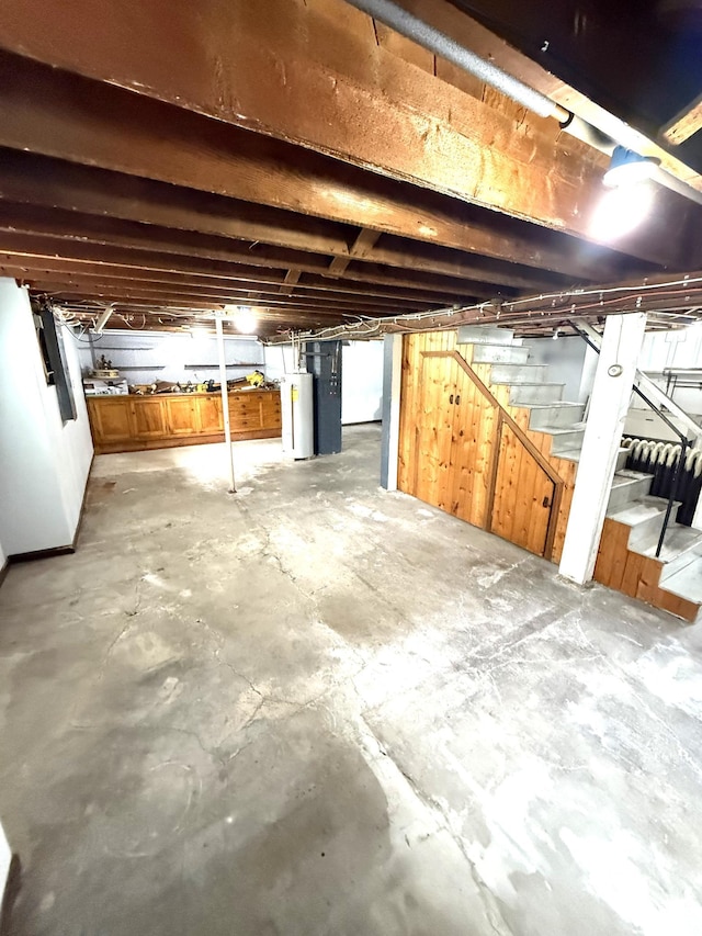 455 3rd St SE, Cokato, MN 55321 - unfinished basement featuring stairs and water heater