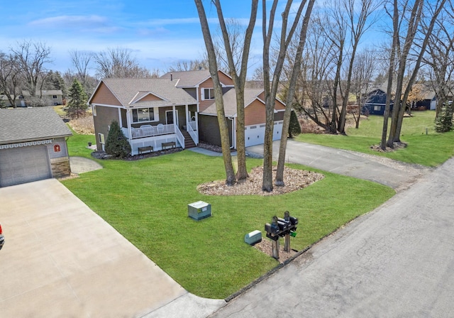 1284 Otter Ridge Rd, White Bear Twp, MN 55110 - view of front of home with a garage, covered porch, concrete driveway, and a front yard