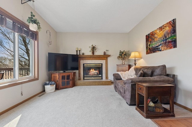 1284 Otter Ridge Rd, White Bear Twp, MN 55110 - living room featuring baseboards, a tiled fireplace, and carpet flooring