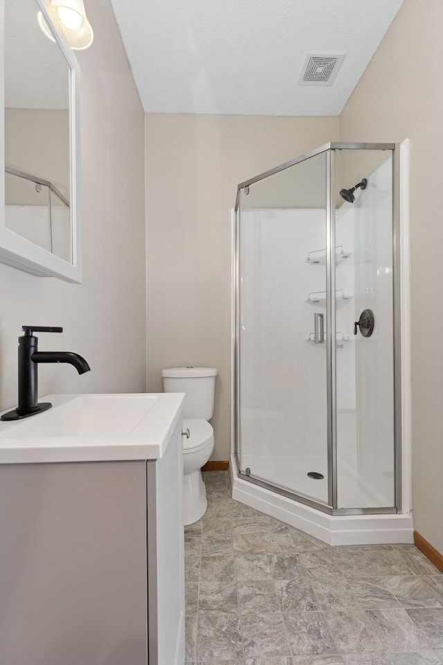 1284 Otter Ridge Rd, White Bear Twp, MN 55110 - bathroom with toilet, a shower stall, vanity, and baseboards