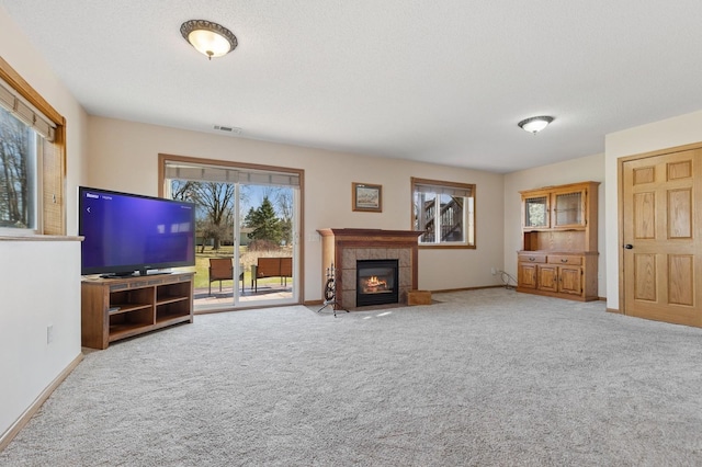 1284 Otter Ridge Rd, White Bear Twp, MN 55110 - unfurnished living room featuring carpet, baseboards, and a fireplace