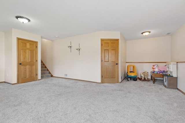 1284 Otter Ridge Rd, White Bear Twp, MN 55110 - carpeted spare room featuring stairs and baseboards