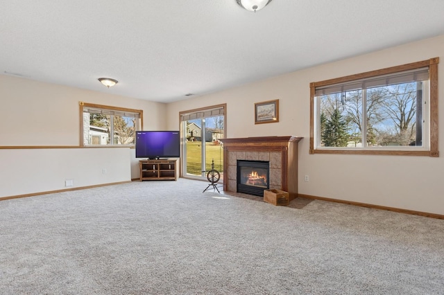 1284 Otter Ridge Rd, White Bear Twp, MN 55110 - unfurnished living room with carpet flooring, baseboards, and a fireplace