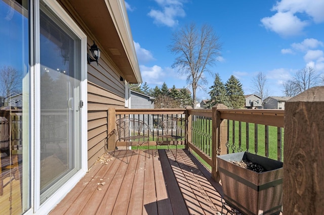 1284 Otter Ridge Rd, White Bear Twp, MN 55110 - wooden terrace with a lawn