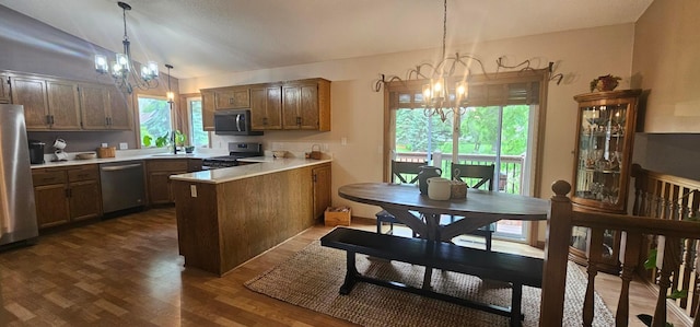 1284 Otter Ridge Rd, White Bear Twp, MN 55110 - kitchen with a chandelier, stainless steel appliances, a peninsula, vaulted ceiling, and a sink