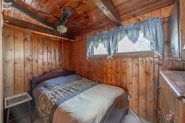 bedroom featuring wooden ceiling, wooden walls, and beamed ceiling