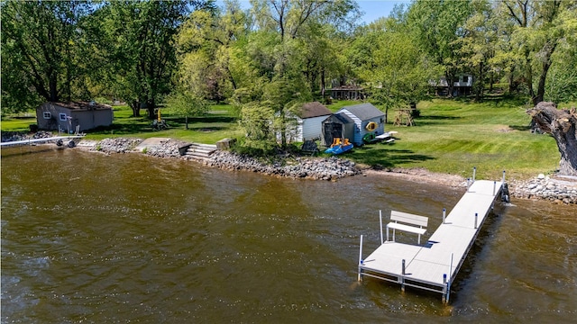 dock featuring a lawn and a water view
