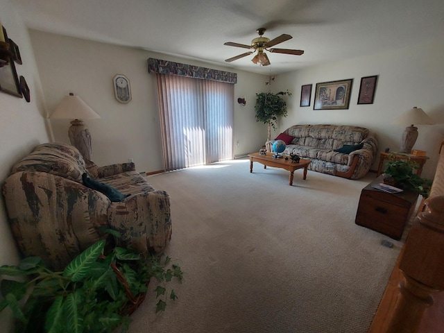 carpeted living area featuring a ceiling fan