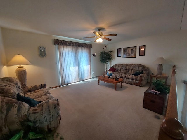 living room with a ceiling fan and carpet
