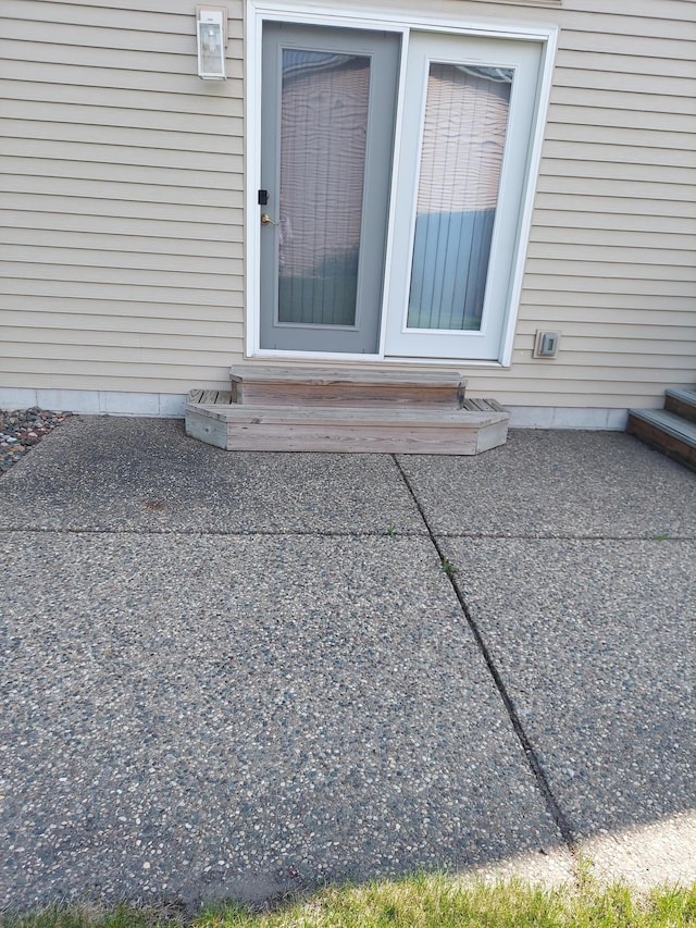 doorway to property with a patio area