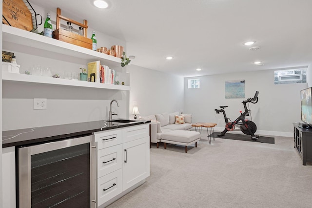indoor wet bar featuring wine cooler, light carpet, recessed lighting, and baseboards