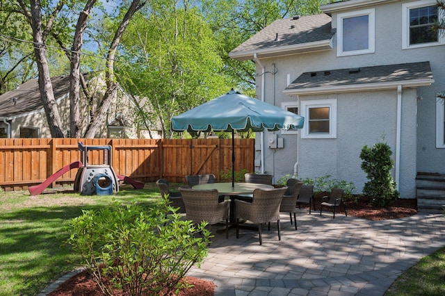 view of patio featuring fence and outdoor dining area