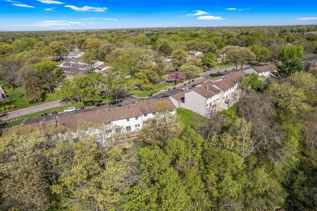 aerial view of property's location featuring a heavily wooded area