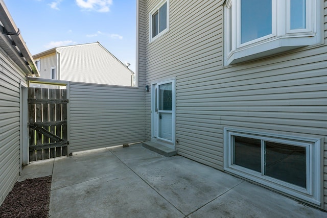 view of patio / terrace featuring fence