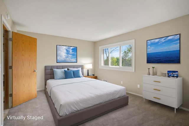 bedroom featuring carpet flooring and baseboards