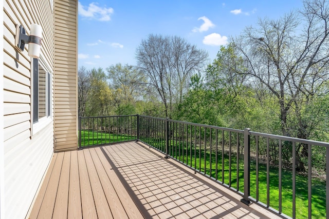 wooden terrace with a lawn