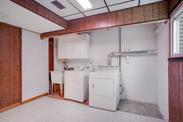 laundry area featuring cabinet space and washing machine and clothes dryer