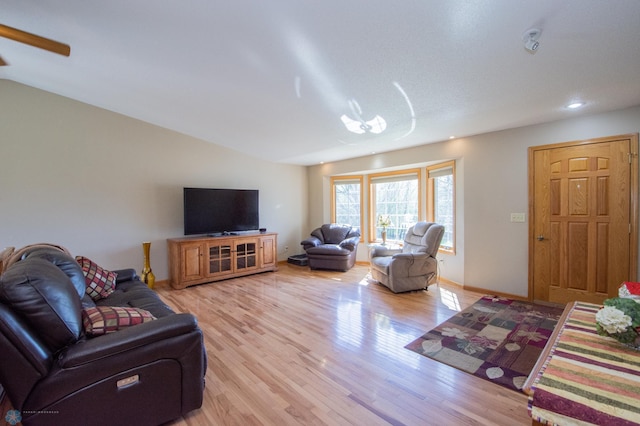 6673 230th St N, Cromwell Twp, MN 56549 - living room with light wood-style floors, baseboards, vaulted ceiling, and recessed lighting